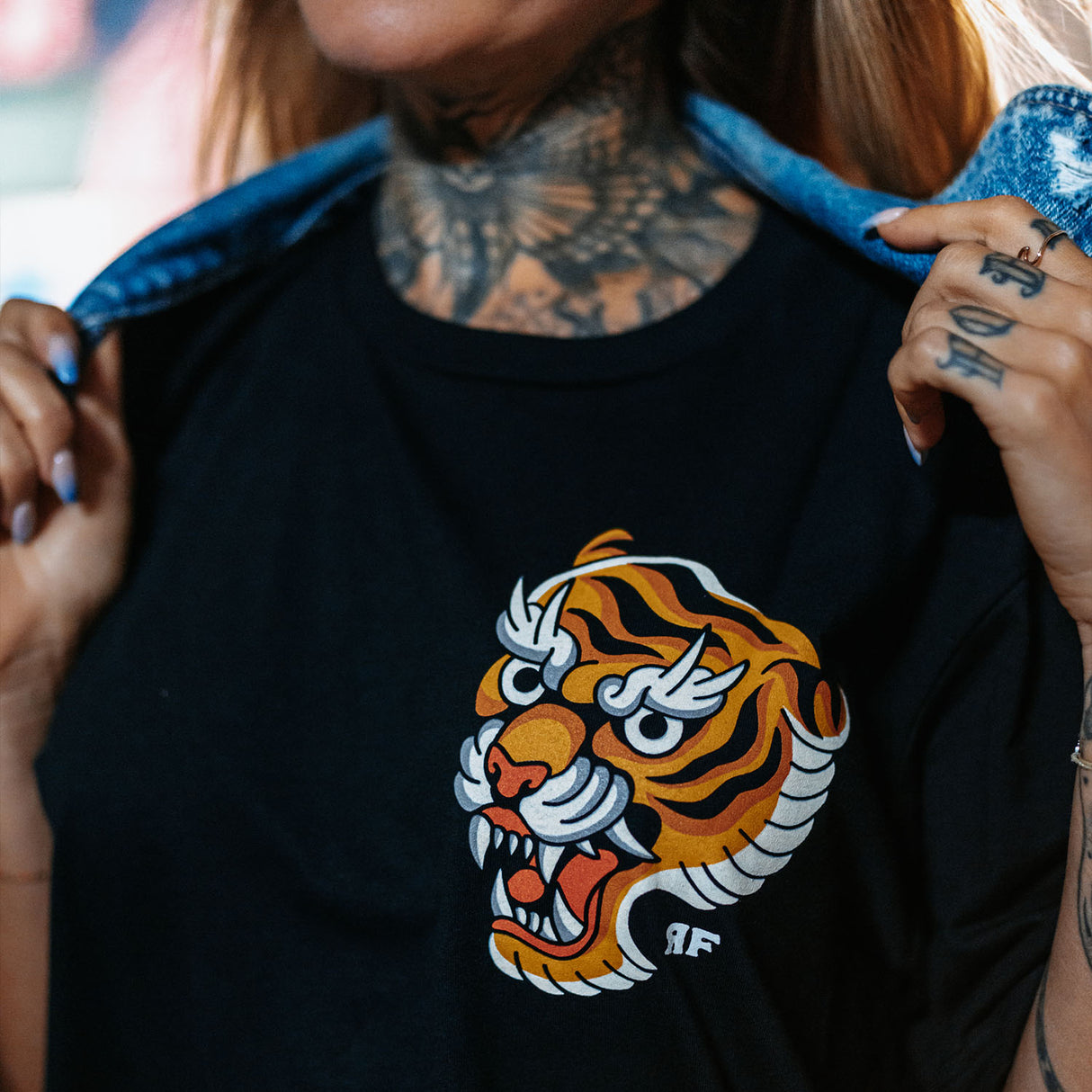 Female model outdoors wearing unisex Active Tee with 'Make Excuses or Make Progress' graphic