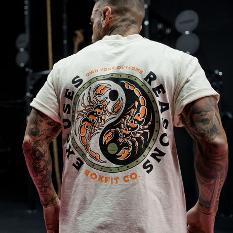 Male model in a gym wearing Street Tee with 'Excuses or Reasons' graphic