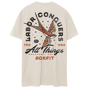 Back view of unisex heather sand Active Tee with 'Labor Conquers All Things' graphic