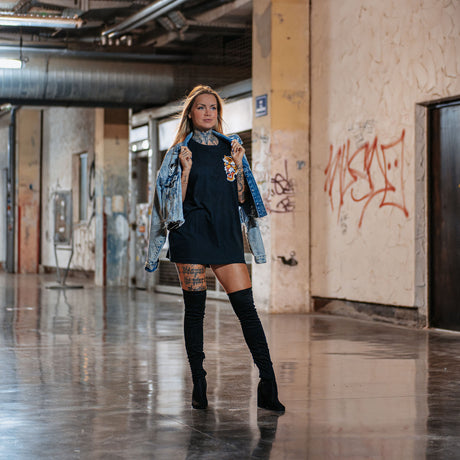 Female model outdoors wearing unisex Active Tee with 'Make Excuses or Make Progress' graphic